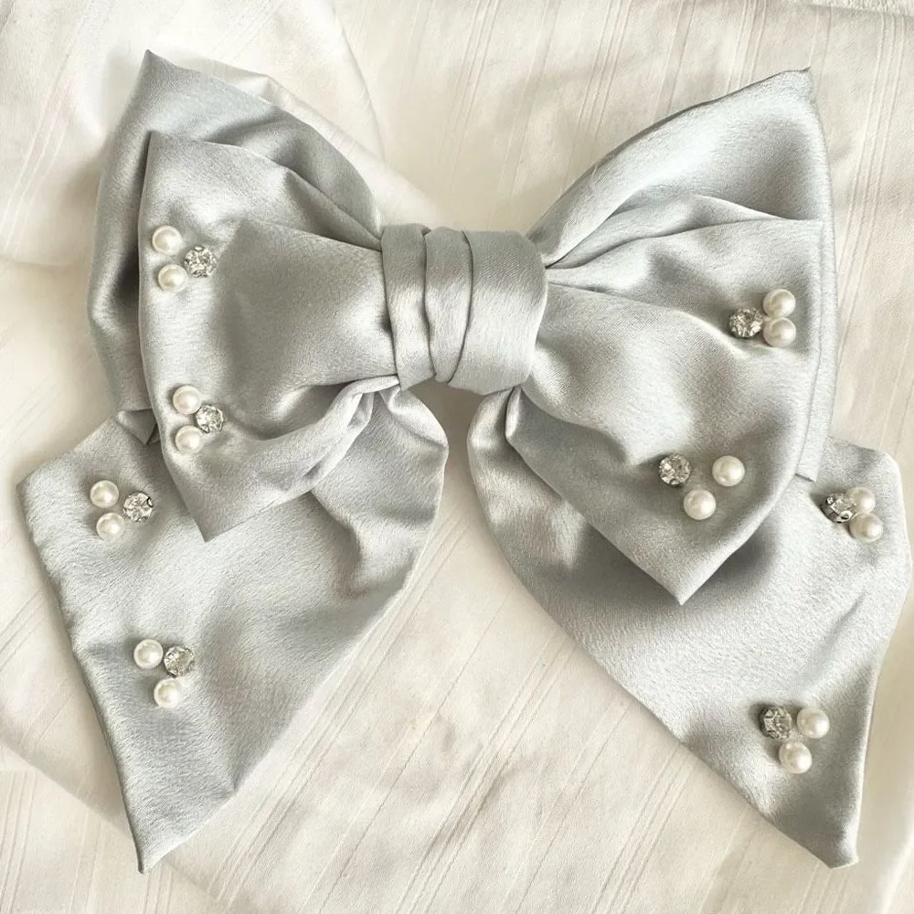 Light grey bow with rhinestone and pearl embellishment